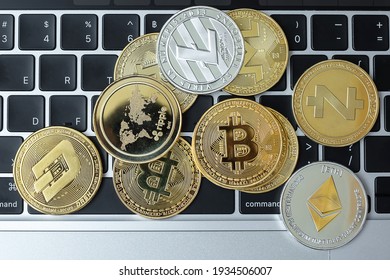 golden and silver Cryptocurrency on keyboard laptop, Bitcoin , Ethereum, Litecoin, Dash, Monero, Zcach and Ripple coins. Crypto is Digital Money within the blockchain network