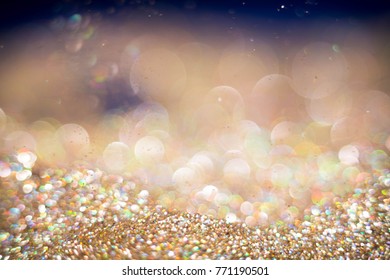 Golden and silver glitter backgound with bokeh abstract blur effect  - Shutterstock ID 771190501