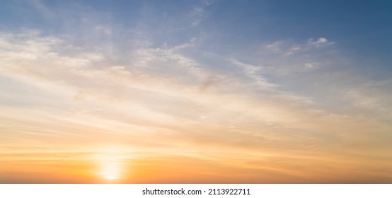 Golden Sky, Sunset Cloud sky background in Evening gold Sky Hour with Romantic Orange, Yellow Warm Sun Light Summer season, Horizon landscape sundown 