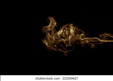 Golden Smoke On Black Background