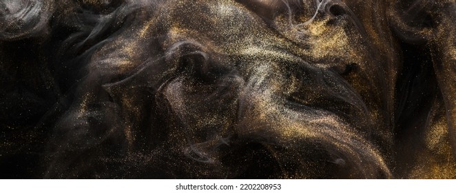 Golden sparkling abstract background, luxury black smoke, acrylic paint underwater explosion, cosmic swirling ink - Shutterstock ID 2202208953