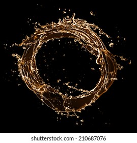 Golden splashes circle, isolated on black background