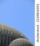 A golden Star of David atop a green dome on the Sofia Synagogue, the largest synagogue in Southeastern Europe.  Image has copy space.