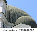 A golden Star of David atop a green dome on the Sofia Synagogue, the largest synagogue in Southeastern Europe.  Image has copy space.