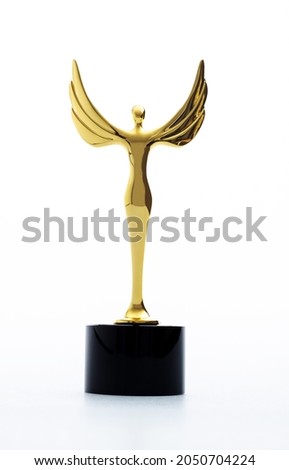 Golden statuette of a woman with wings.