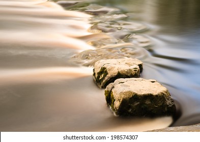 Golden Stepping Stones In A River