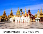 Golden stupas in Shwedagon Zedi Daw (Great Dagon Pagoda, Golden Pagoda), Yangon, Myanmar. On blue sky background