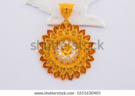 Golden Sunflower Pendent isolated in white background