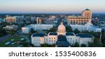 Golden sunlight reaches the horizon showing around the capital statehouse in Montgomery Alabama