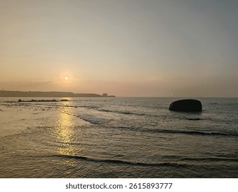 Golden sunrise over Galle Fort Beach in Sri Lanka, with scenic coastal beauty, calm waters, and historic charm near the iconic UNESCO-listed Galle Fort