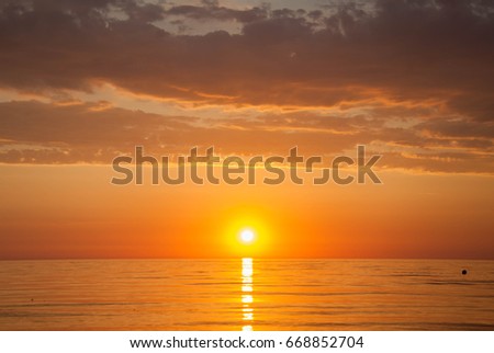 Golden sunset on the horizon of the sea