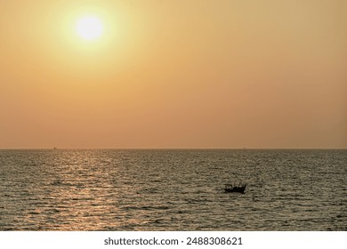 Golden Sunset over the Ocean with a Lone Boat,Peaceful Sunset Seascape with a Small Fishing Boat,Calm Ocean at Sunset with a Silhouette of a Boat - Powered by Shutterstock