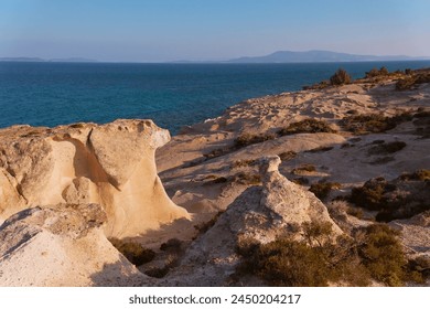 Golden Sunset Over Rocky Shoreline, Tranquil Rocky Shoreline and Pebble Beach at Sunset,  - Powered by Shutterstock