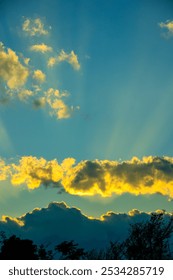 Golden Sunset Rays Through Clouds