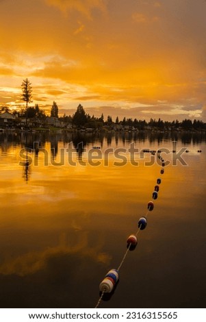 Golden sunset and reflections on Lake Meridian in Kent, WA
