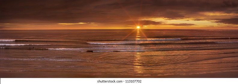 A Golden Sunset For The Golden State, The Truly "Pacific" Ocean On This Evening As Waves Roll Across The Long Wide Beach Near San Diego, California, USA