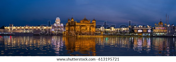 The Golden Temple at Amritsar, Punjab, India, the most sacred icon and worship place of Sikh religion. Illuminated in the night, reflected on lake. 