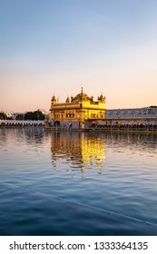 Golden Temple Of Amritsar Shining Gold During Sunset In Punjab