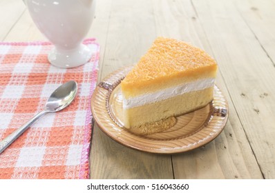 Golden Threads Chiffon Cake On Wooden Background