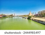 Golden Tower (Torre del Oro) with Guadalquivir River in Seville during a Sunny Day, Andalusia, Spain