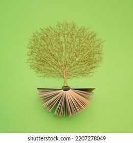 Golden Tree Growing From The Old Book, Education And Knowledge Concept. For Book Lovers. Flat Lay.