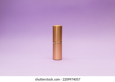 Golden Tube On Purple Background