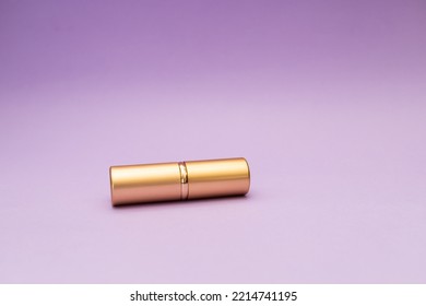 Golden Tube On Purple Background