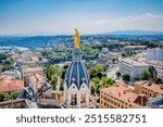 Golden Virgin and aerial view of Lyon from the roofs of the Basilica Notre dame de Fourvière