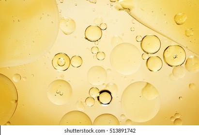 Golden water with bubbles, shapes and waves
