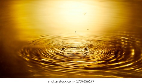 Golden Water Ripple And Water Drop