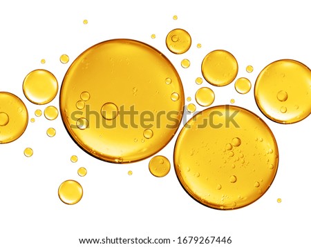 golden yellow bubble oil or serum isolated on white background