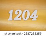 The golden yellow painted wood panel for the background, number 1204, is made from white painted wood.