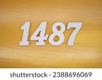 The golden yellow painted wood panel for the background, number 1487, is made from white painted wood.