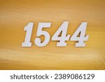 The golden yellow painted wood panel for the background, number 1544, is made from white painted wood.