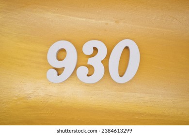 The golden yellow painted wood panel for the background, number 930, is made from white painted wood.