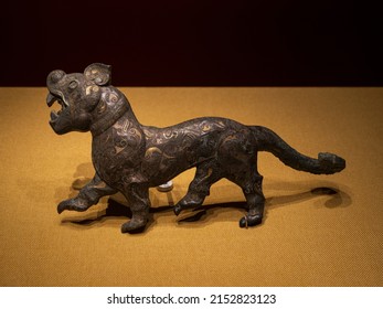 Gold-inlaid Silver Belt-Hook in the Shape of a Tiger, Ancient China Western Han dynasty - Shutterstock ID 2152823123