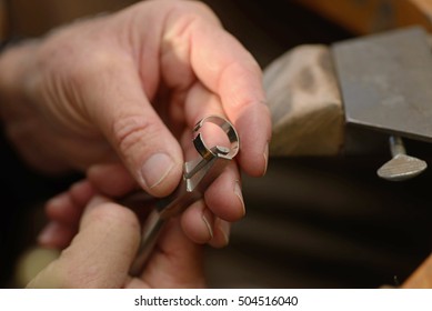 A Goldsmith Resizes A Gold Ring