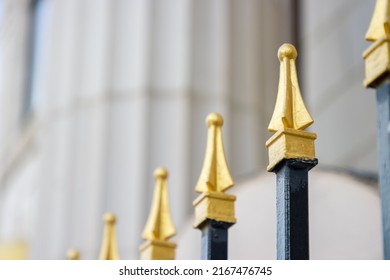 Gold-tipped Security Fence Surrounding Classical Government Building