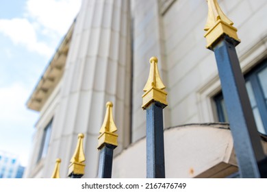 Gold-tipped Security Fence Surrounding Classical Government Building