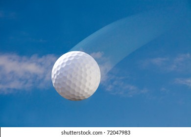 Golf Ball In The Air On A Sunny Day