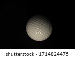 Golf Ball in a black background. Qarantine Photography. Photo captured by Nikon D7000 model Camera and using Nikon AF-S DX NIKKOR 18-140mm f/3.5-5.6G ED VR Lens. 