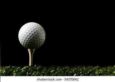 Golf Ball Close Up On Tee At Night , Black Background With Copy Space On Right