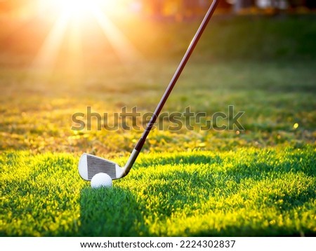 Golf ball close up on tee grass on blurred beautiful landscape of golf background. Concept international sport that rely on precision skills for health relaxation...	