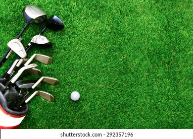 Golf Ball And Golf Club In Bag On Green Grass