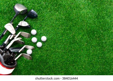 Golf Ball And Golf Club In Bag On Green Grass