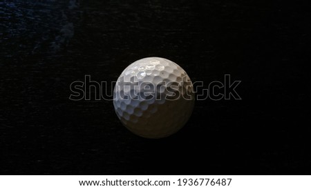 Golf Ball in Dark Background