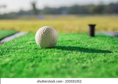 A Golf Ball At A Driving Range.