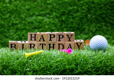 Golf Ball With Happy Birthday Word Is On Green Grass Background