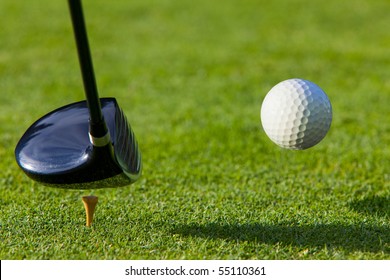 Golf Ball Hit Off The Tee With Driver On Golf Course