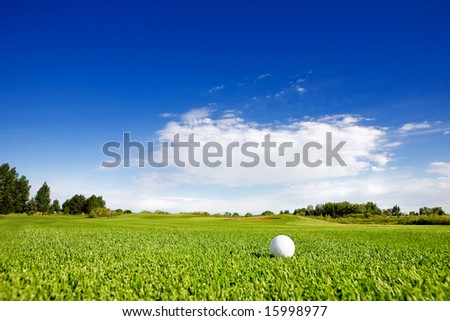 A golf ball on a fairway on a golf course